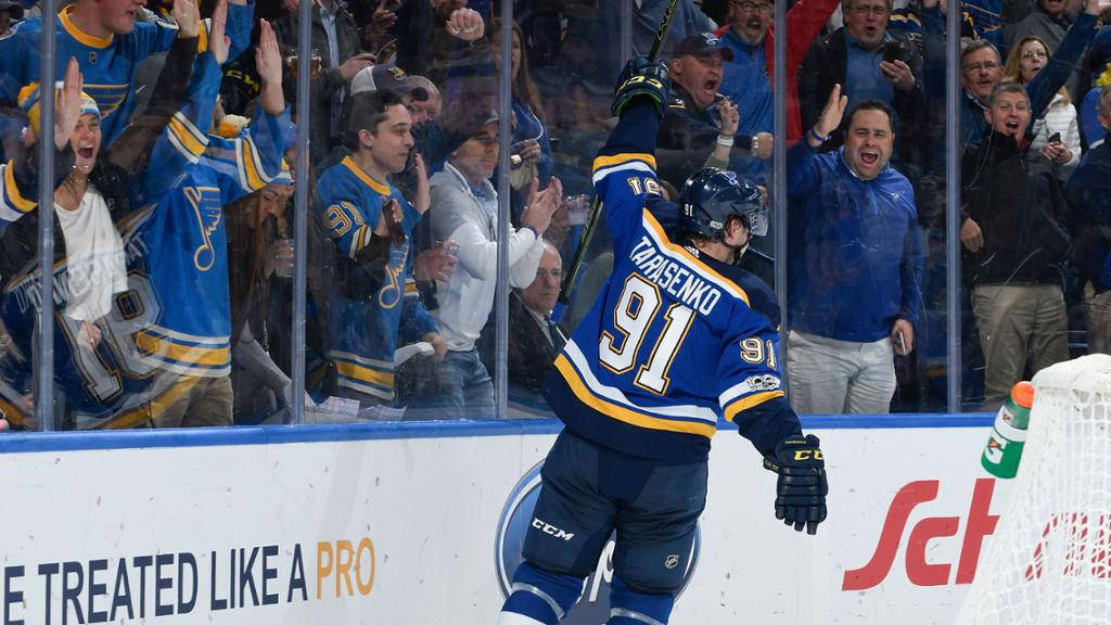 Back View Of Vladimir Tarasenko While Fans Cheer Through The Glass Panels Wallpaper