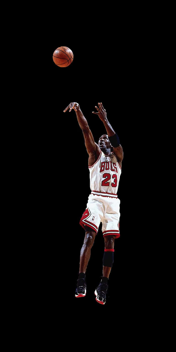 Basketball Legend Michael Jordan Shoots A Clutch Three-pointer. Wallpaper