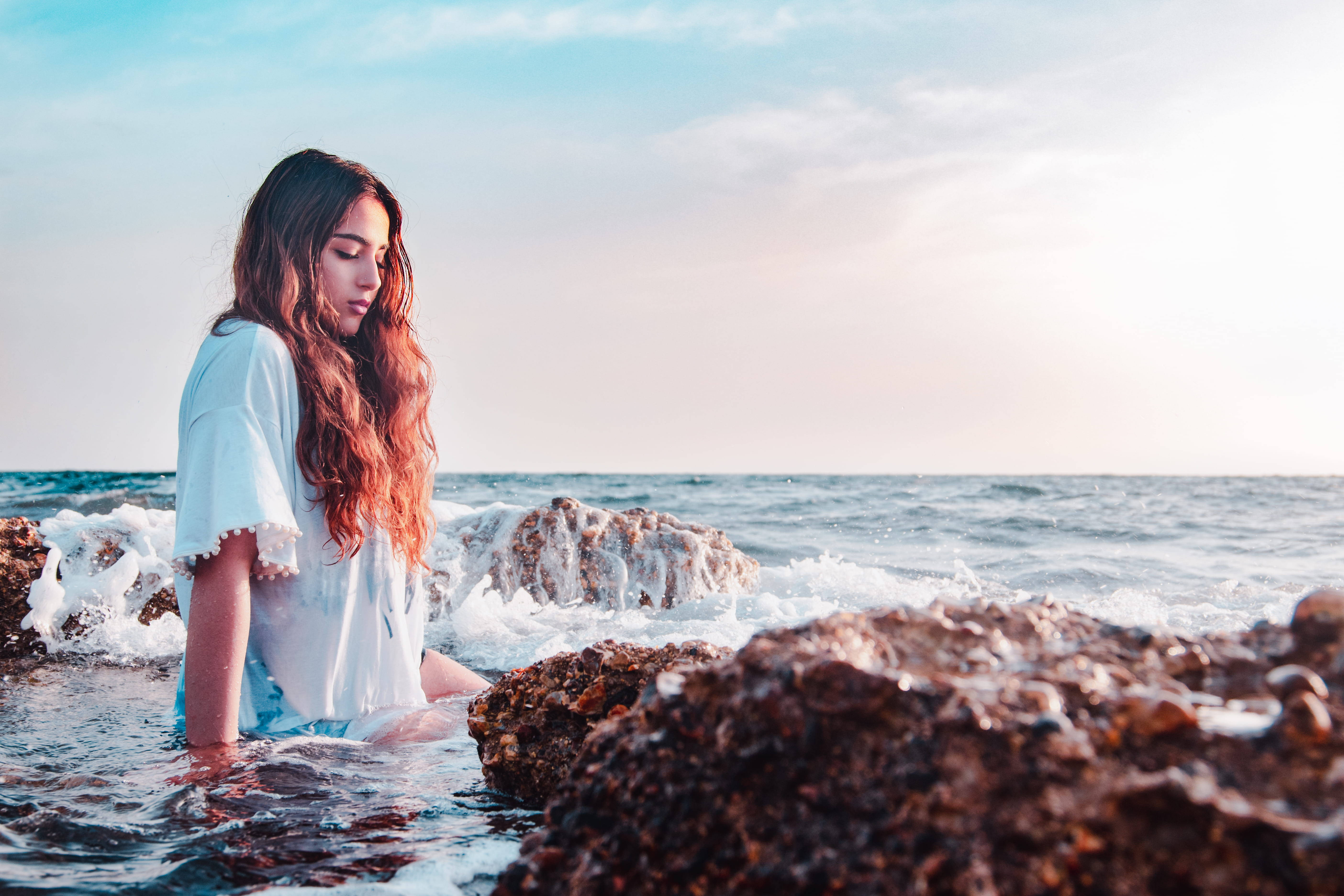 Beach Girl On Rocky Shore Wallpaper