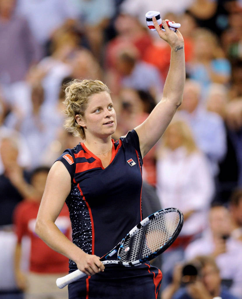 Belgian Tennis Prodigy Kim Clijsters In Action Wallpaper