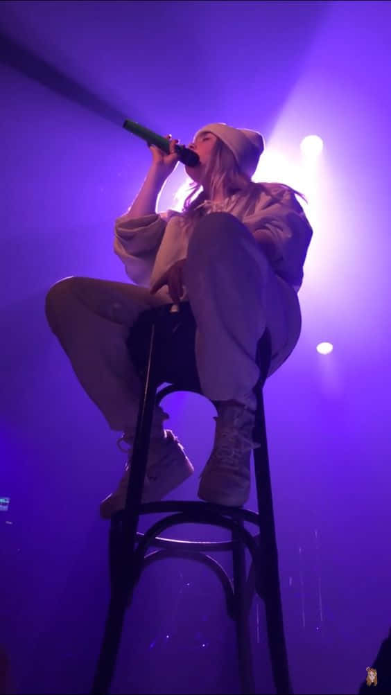 Billie Eilish Purple Low Angle Shot Wallpaper