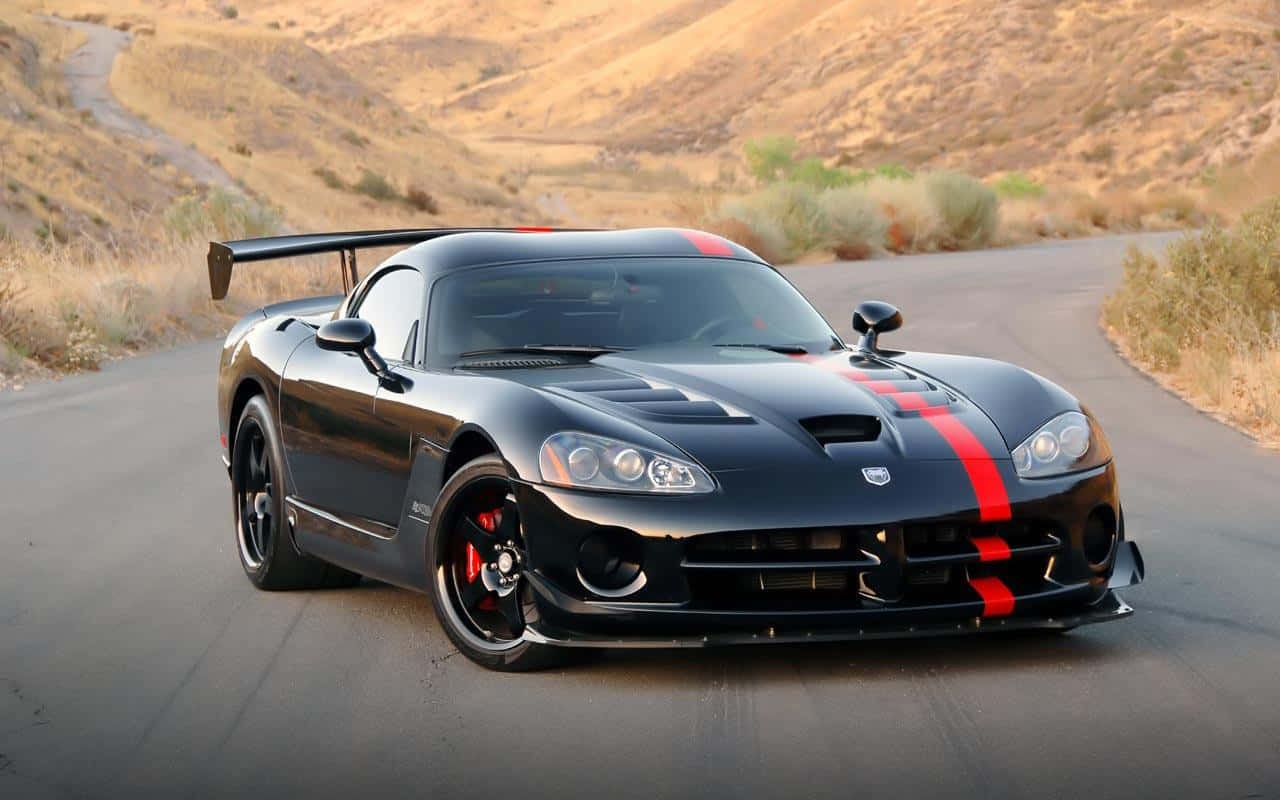 Black Dodge Viper With A Red Stripe Wallpaper