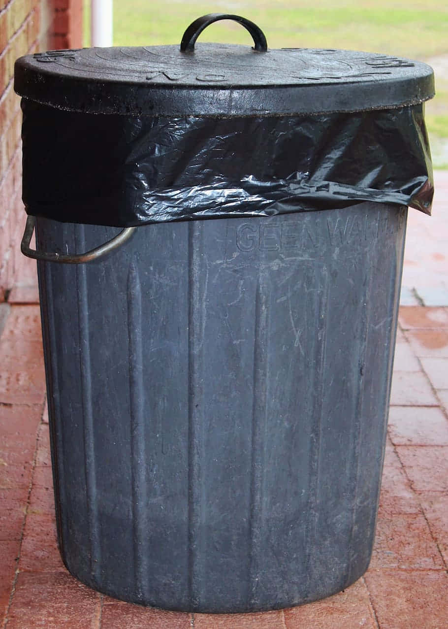 Black Plastic Barrel Trash Can With Lid Wallpaper