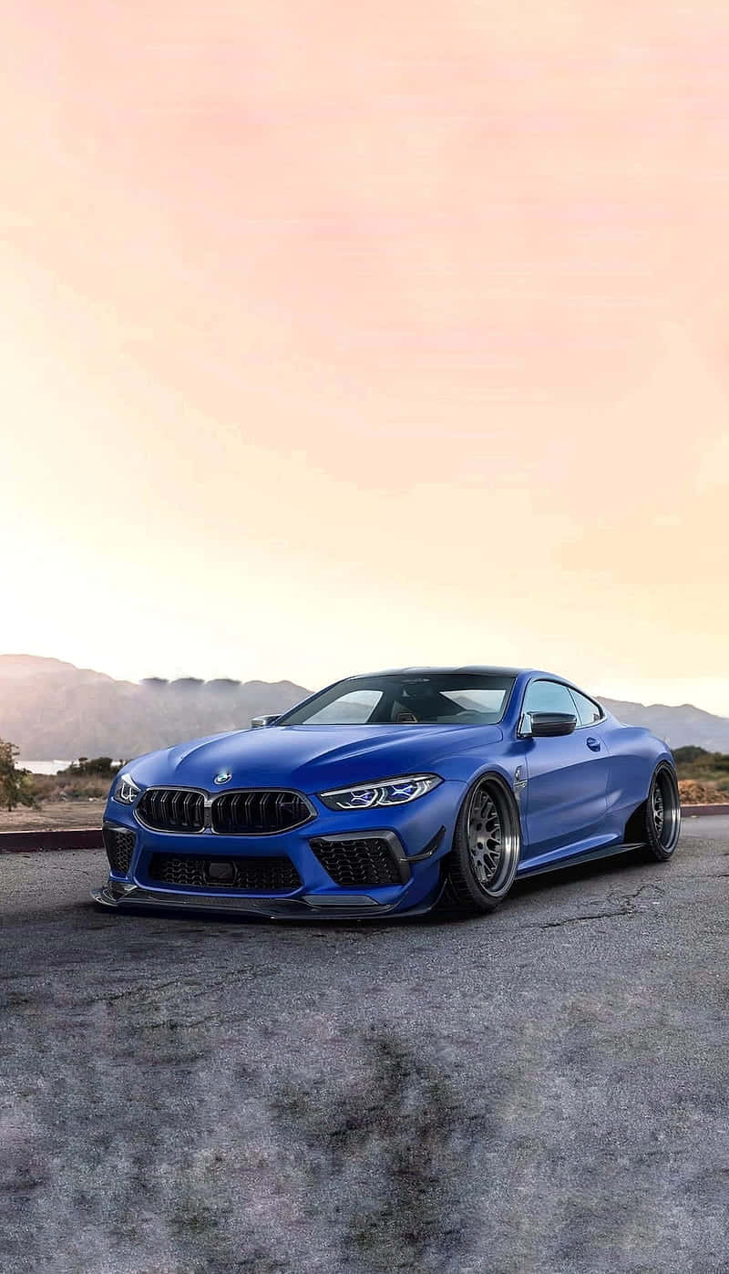 Blue Bmw M8 4k Mobile By The Sunrise Wallpaper