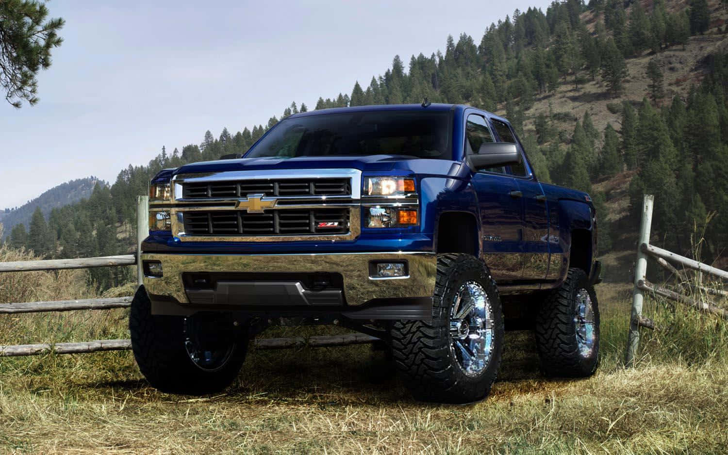 Blue Lifted Truck On Field Wallpaper