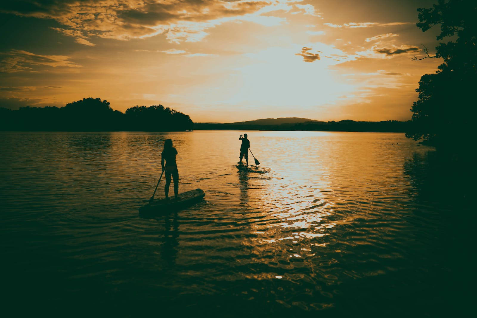 Boating During A Calming Sunset Wallpaper