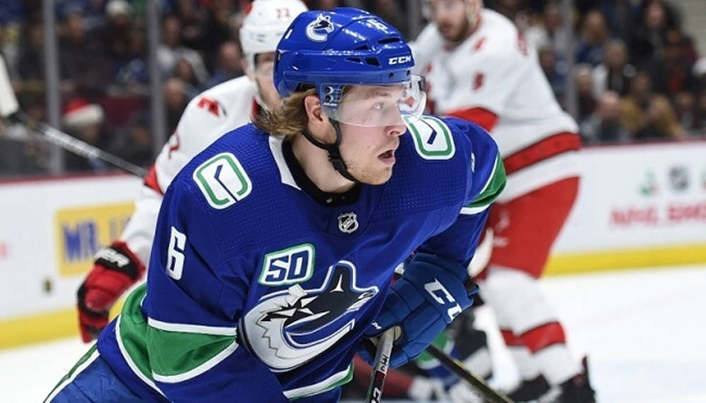 Brock Boeser Vancouver Canucks Chasing Puck Wallpaper