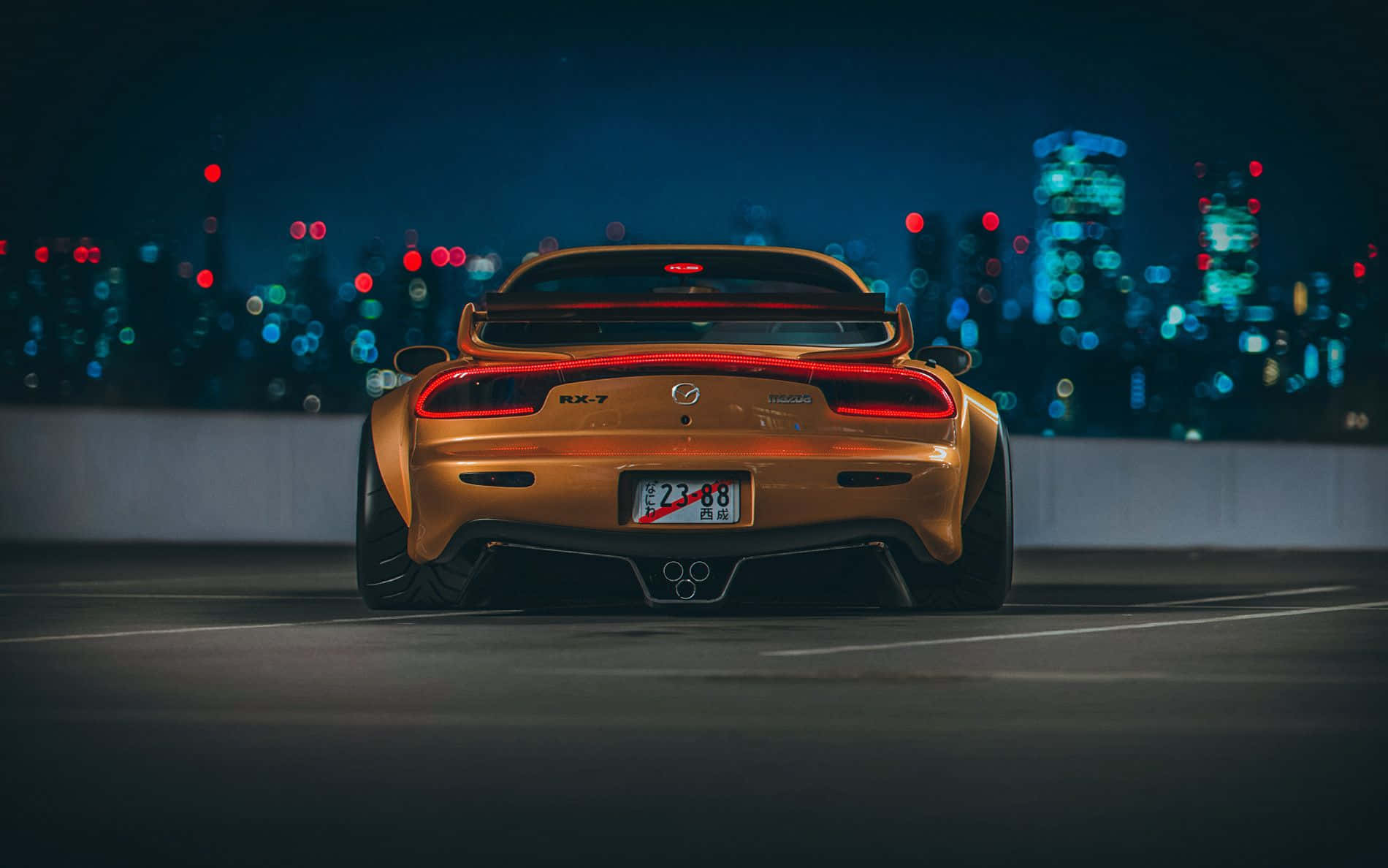 Brown Mazda Rx 7 With Cityscape Wallpaper