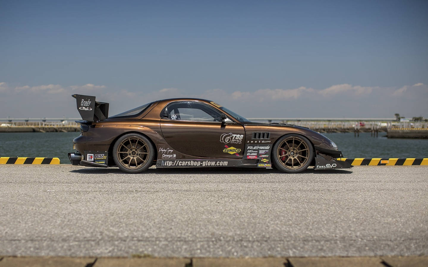 Brown Mazda Rx7 In Pier Wallpaper