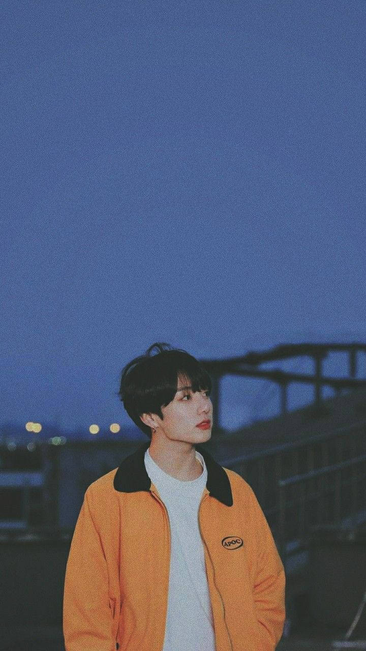 Bts Cute Aesthetic Jungkook Orange Jacket Wallpaper