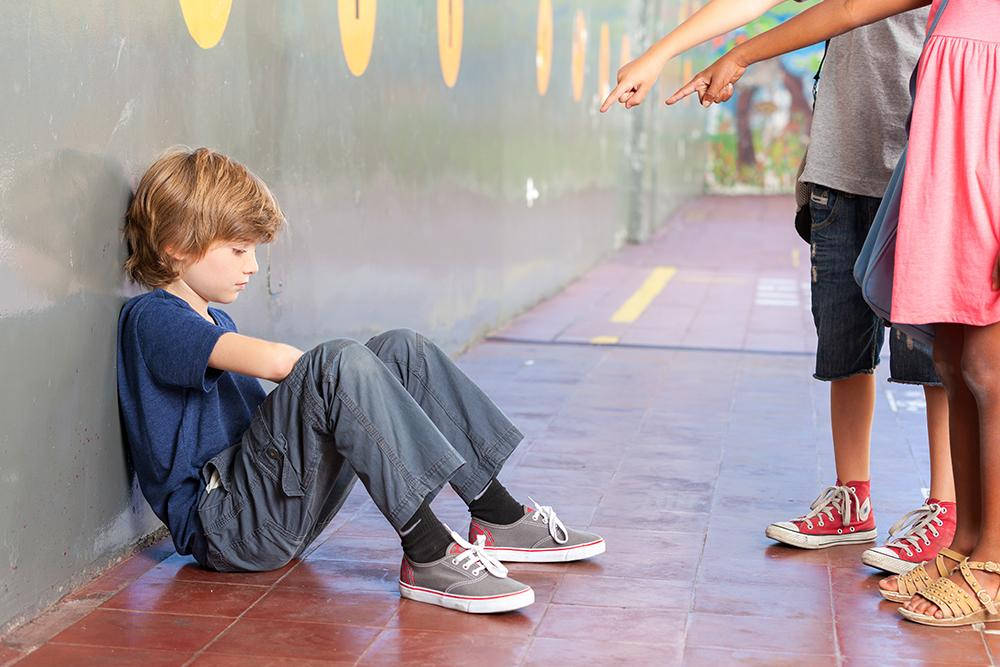 Bullied Boy With Mean Kids Pointing At Him Wallpaper