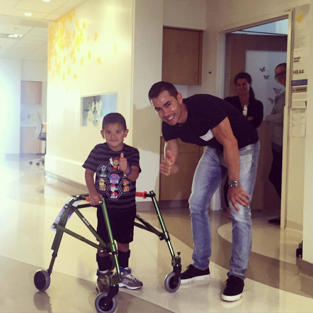 Camilo Villegas And Injured Child Wallpaper