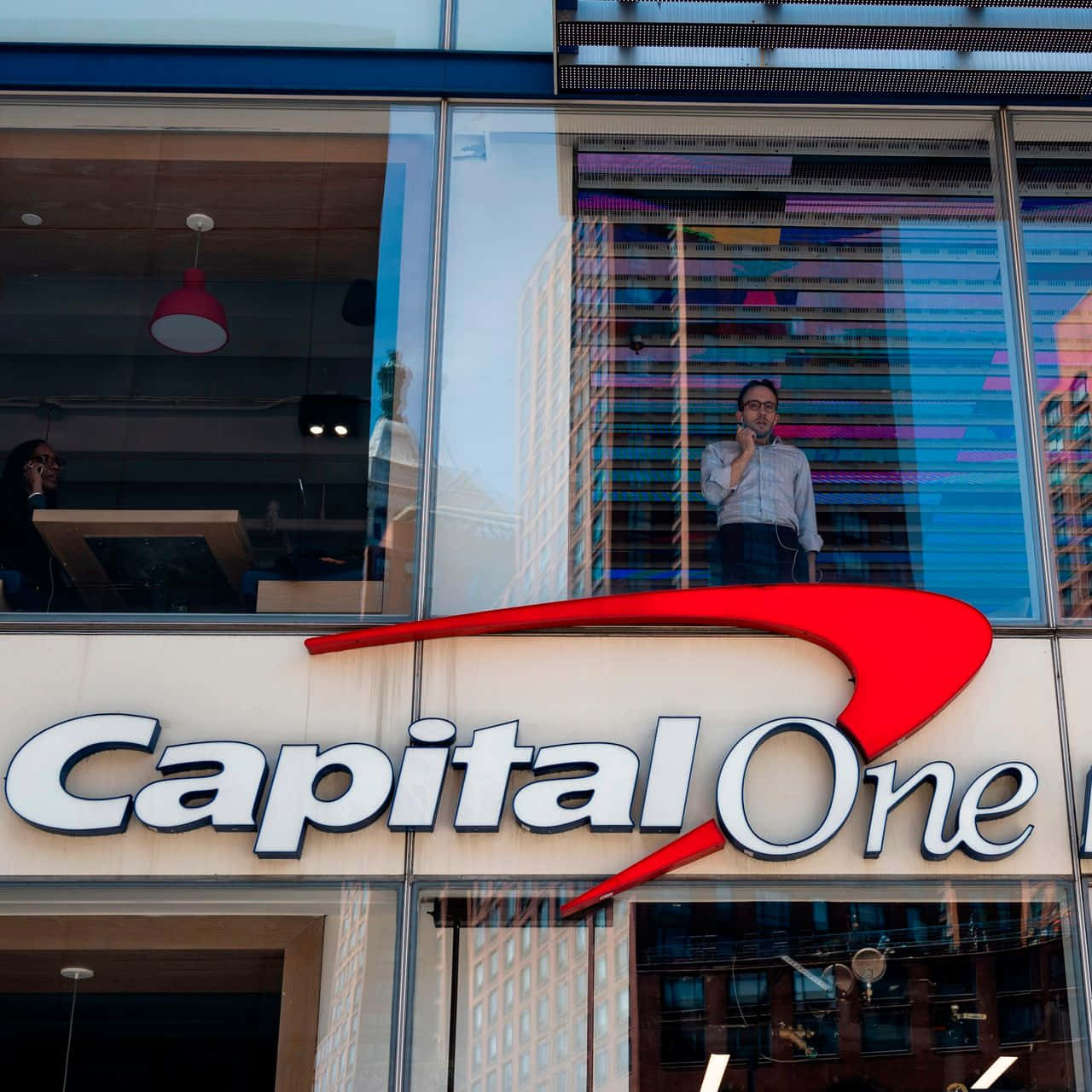 Capital One With Man Standing Wallpaper