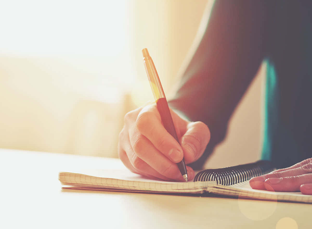 Caption: A Close-up View Of A Gold And Black Fountain Pen Wallpaper