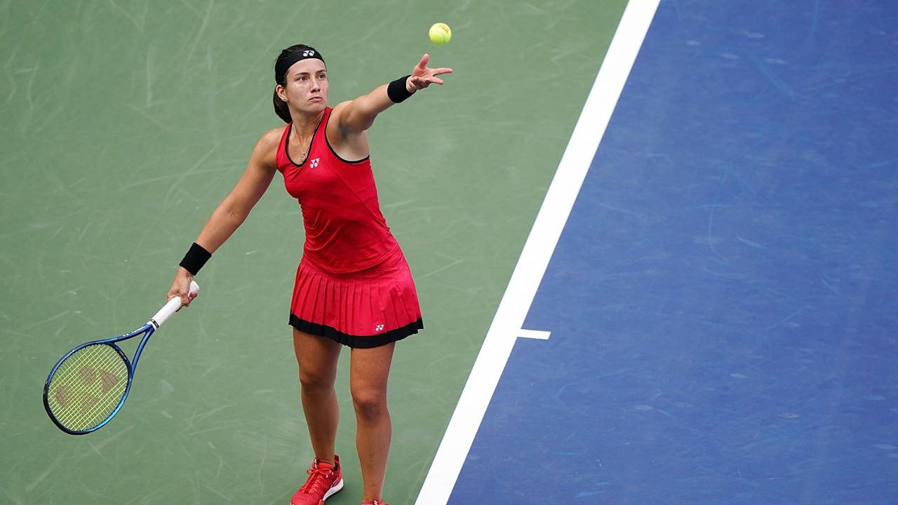 Caption: Anastasija Sevastova Perfecting A Serve Toss In Tennis Wallpaper