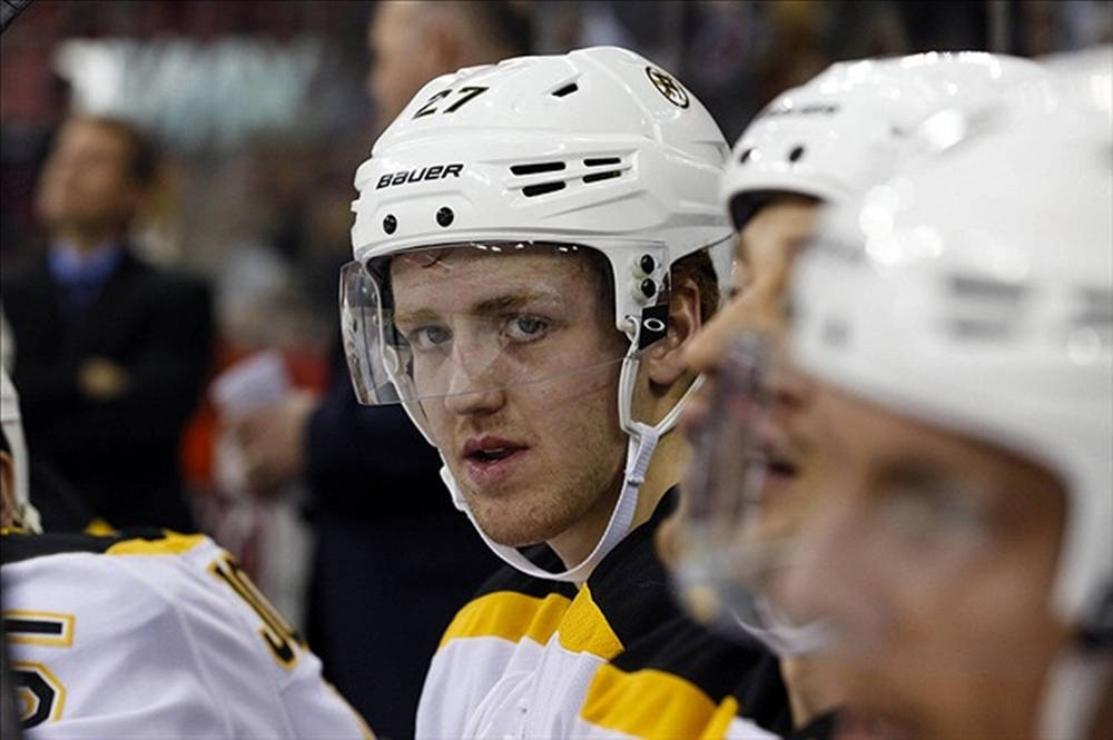 Caption: Dougie Hamilton Ready For Action In Boston Bruins Bench Wallpaper