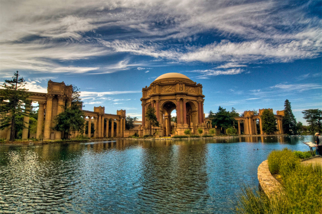 Caption: Majestic View Of The Palace Of Fine Arts Under Clear Blue Sky Wallpaper