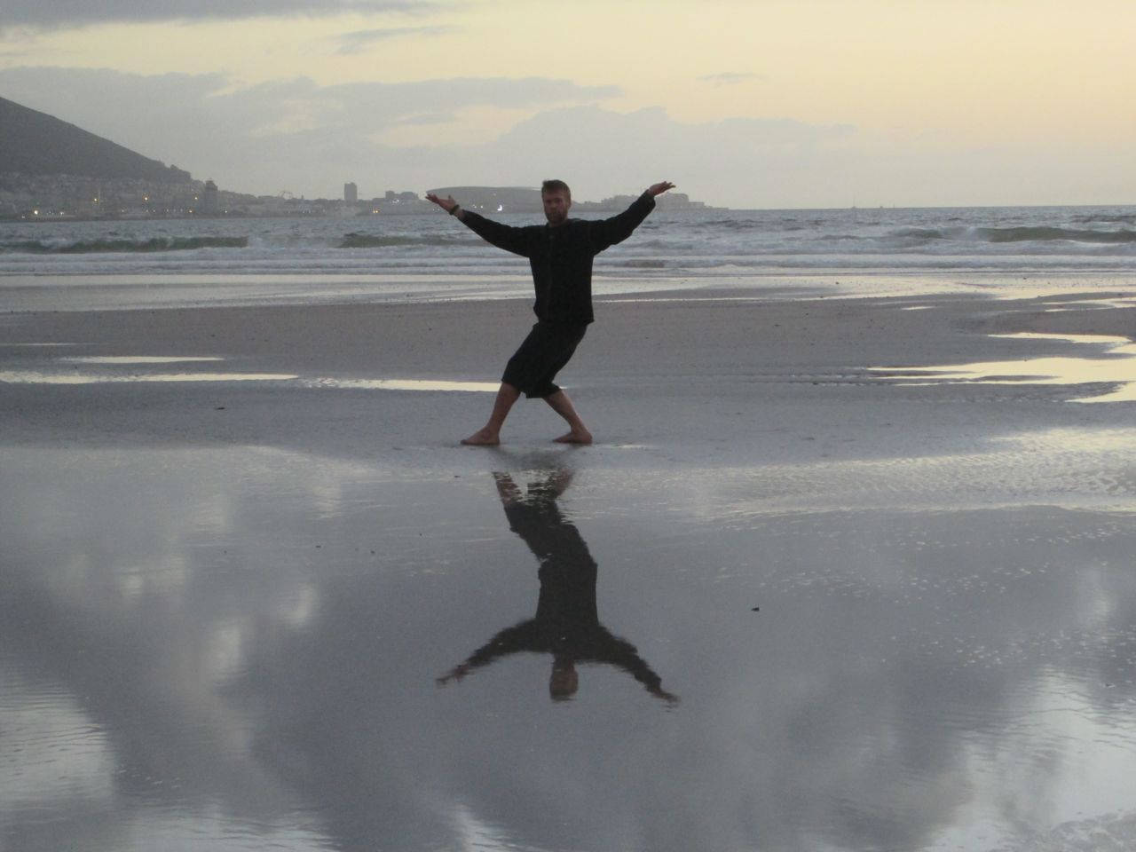 Caption: Martial Artist Practicing Bagua By The Sea Wallpaper