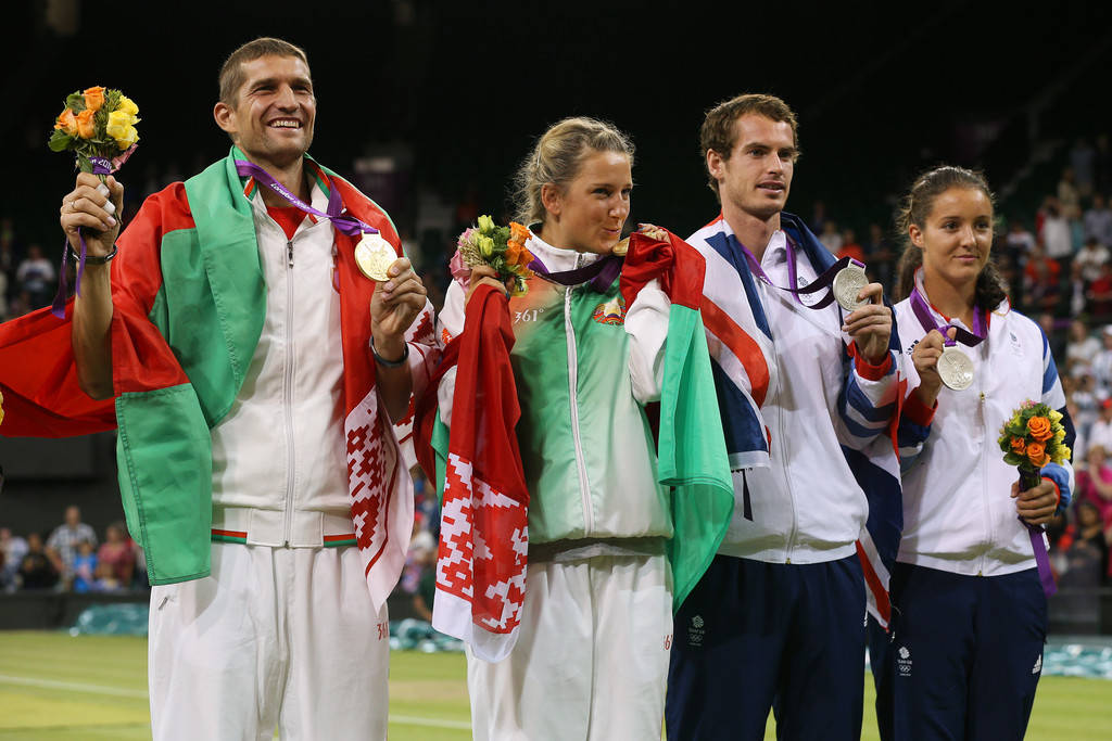 Caption: Max Mirnyi Celebrating Victory With Fellow Winners Wallpaper