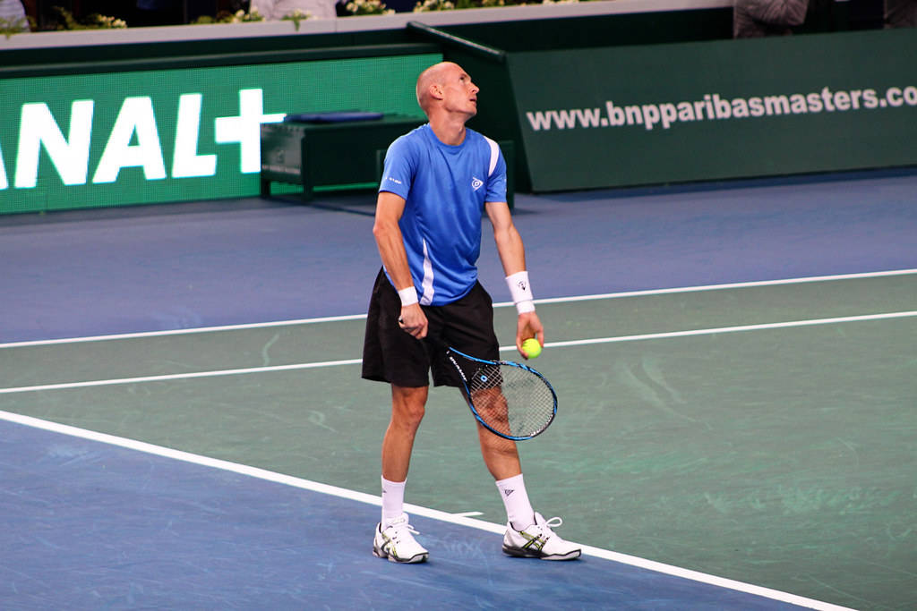 Caption: Nikolay Davydenko Serving At The Indian Wells Open Wallpaper