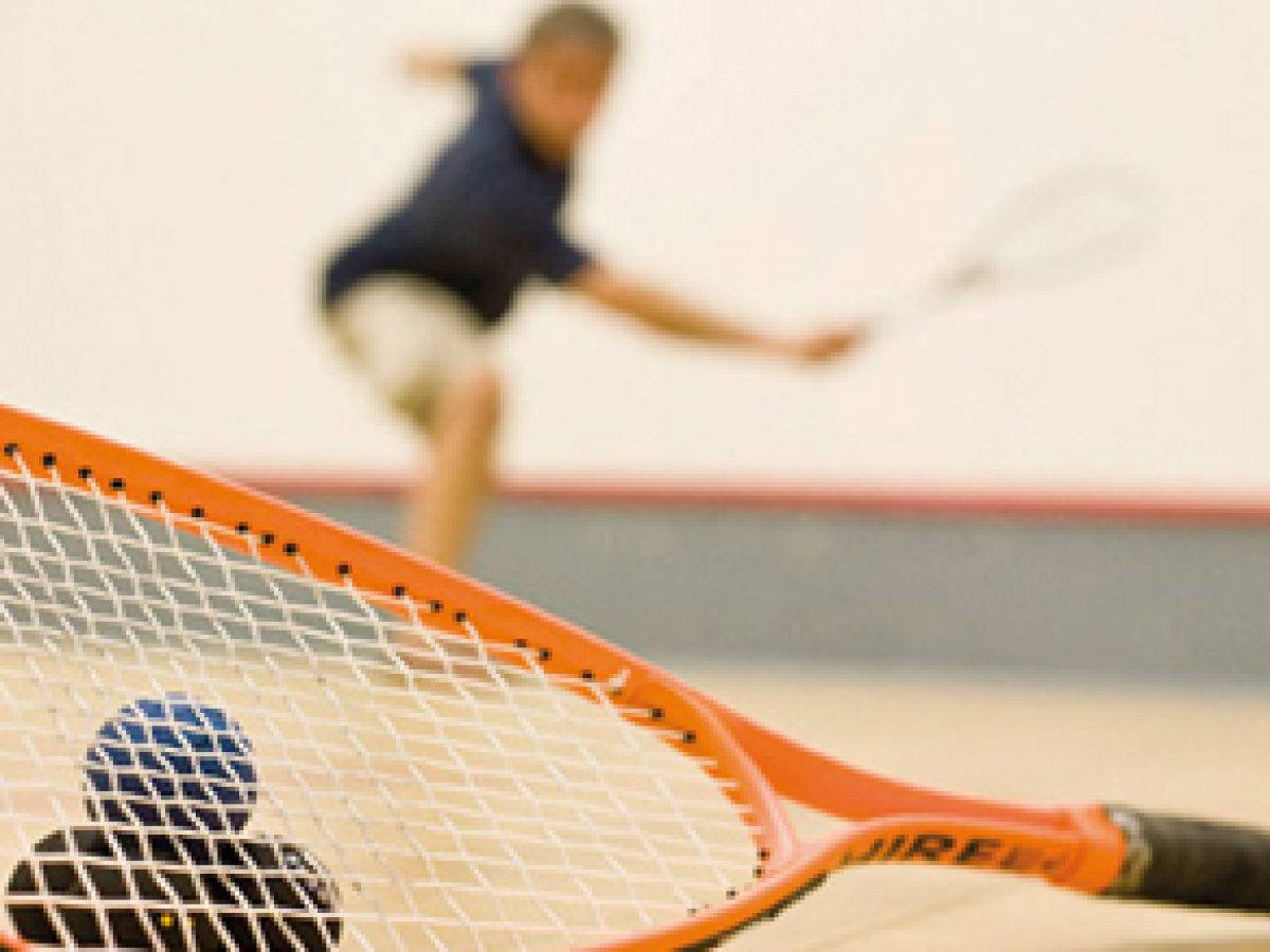 Caption: Orange Squash Racket Lifelike Image. Wallpaper