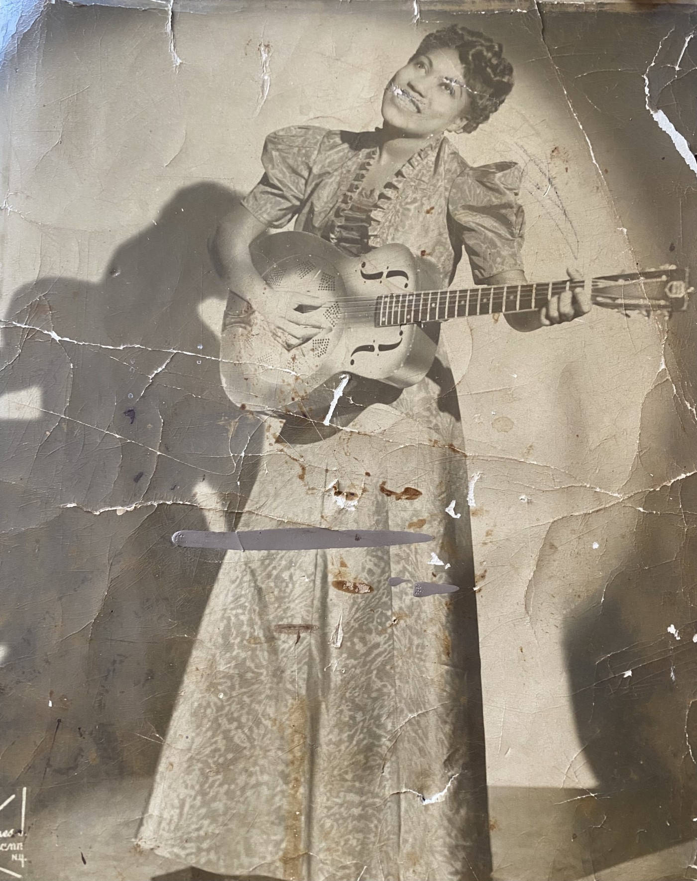 Caption: Sister Rosetta Tharpe Strumming Her Guitar On Vintage Photo Wallpaper