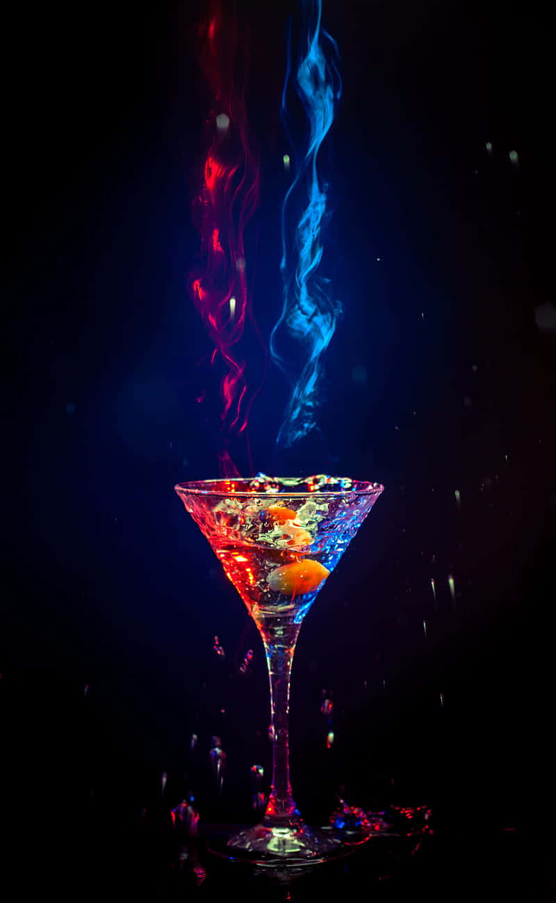 Caption: Spectacular Splash Of Blue And Red Cocktails Wallpaper