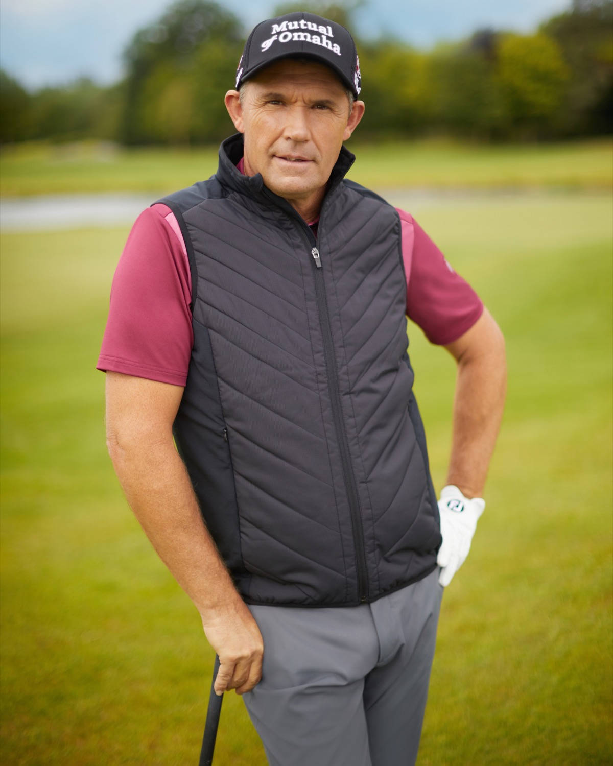 Caption: Three-time Major Champion Padraig Harrington Leaning On His Golf Club. Wallpaper