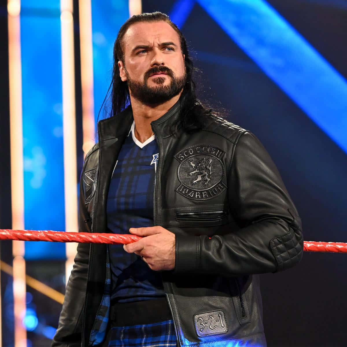 Caption: Wwe's Drew Mcintyre Sporting Leather Fashion Wallpaper