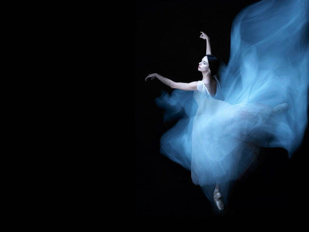 Captivating Ballet Dance In Ethereal Blue Gown Wallpaper