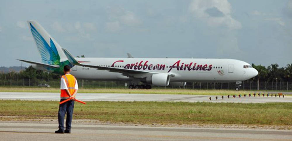 Caribbean Airlines Plane And Airport Enforcer Wallpaper