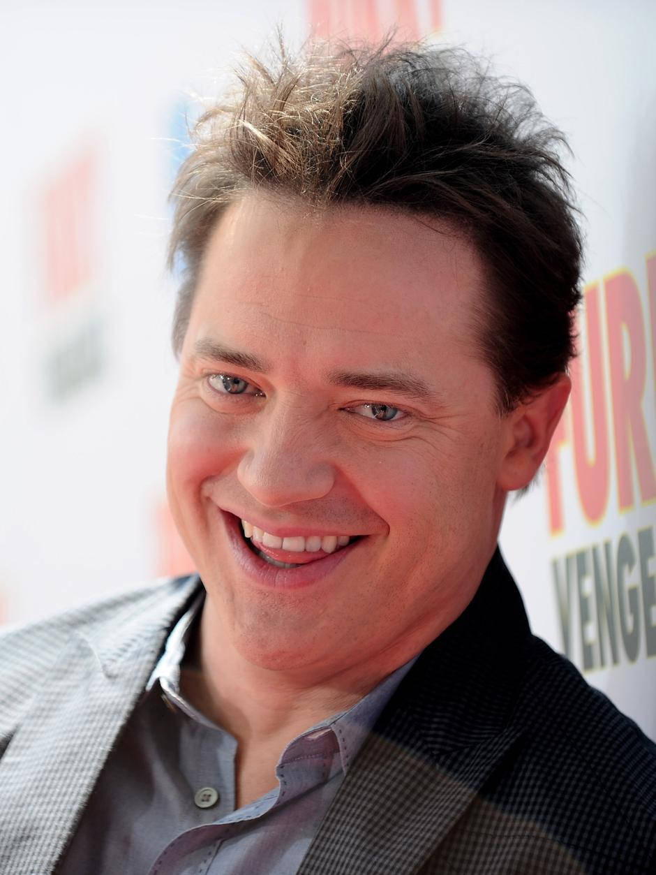 Charming Brendan Fraser In A Pensive Moment Wallpaper