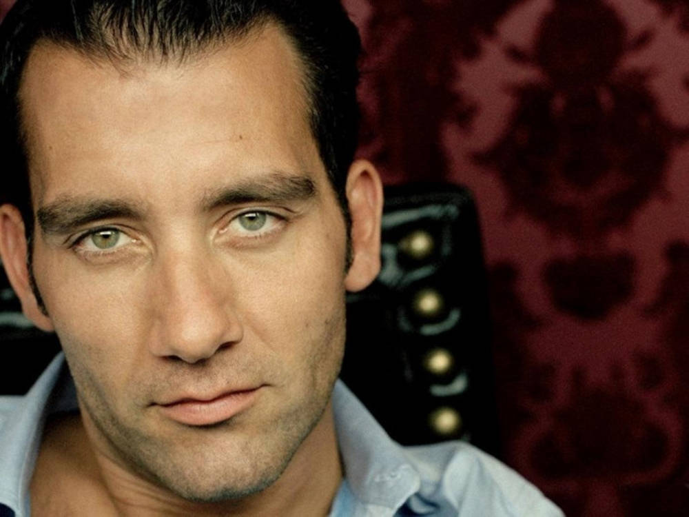 Clive Owen - Charisma Personified In Red Wallpaper