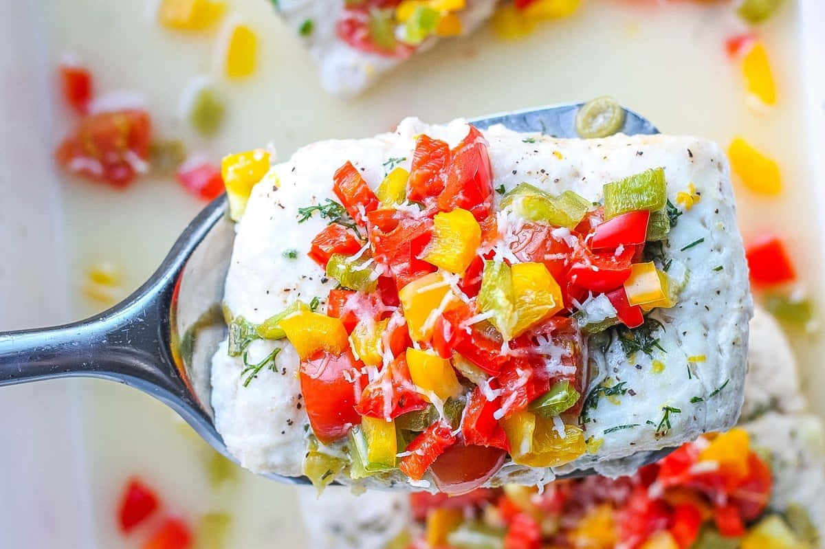 Colorful Halibut Steakwith Vegetable Topping Wallpaper