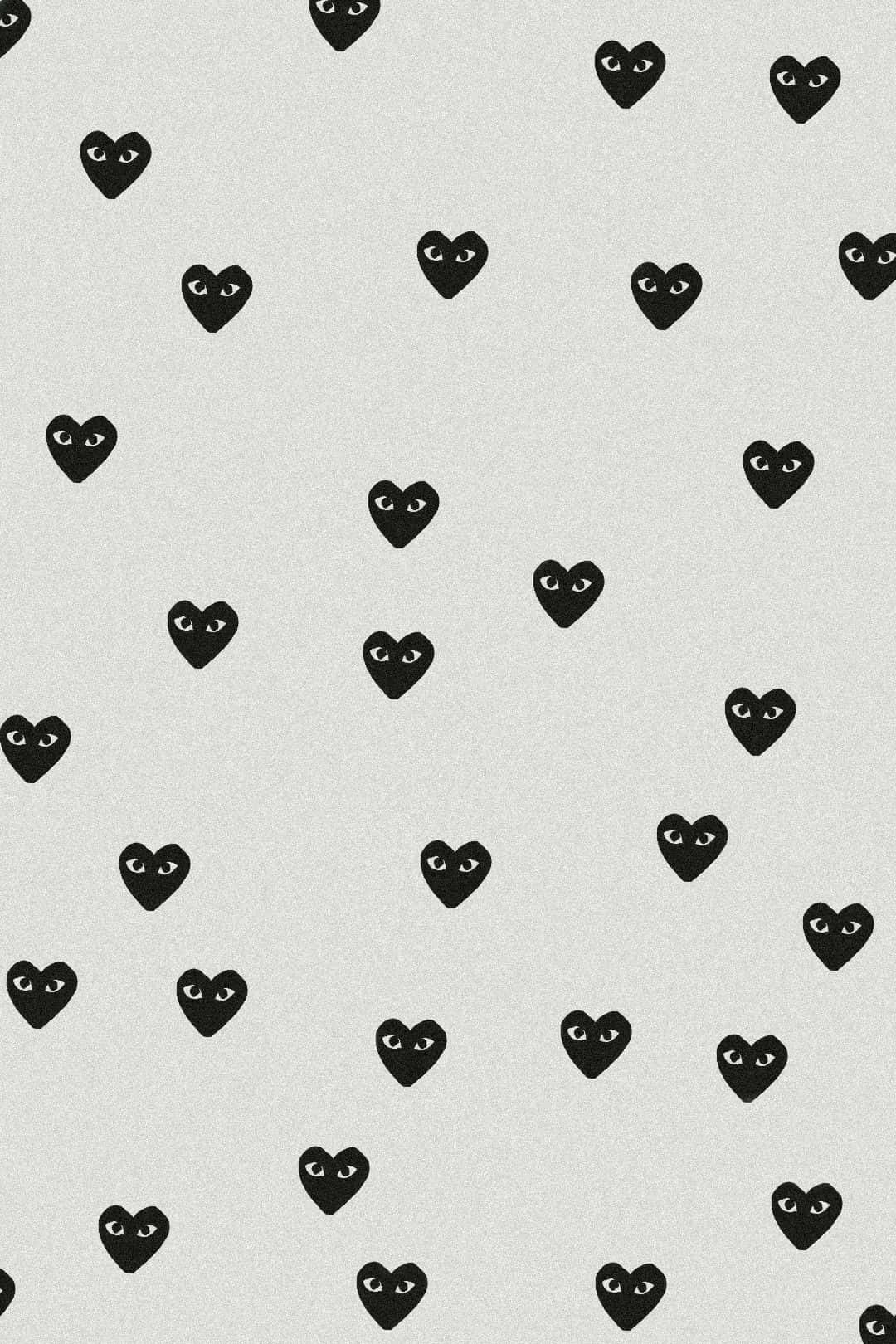 Comme Des Garçons Iconic Hearts On Gray Background Wallpaper