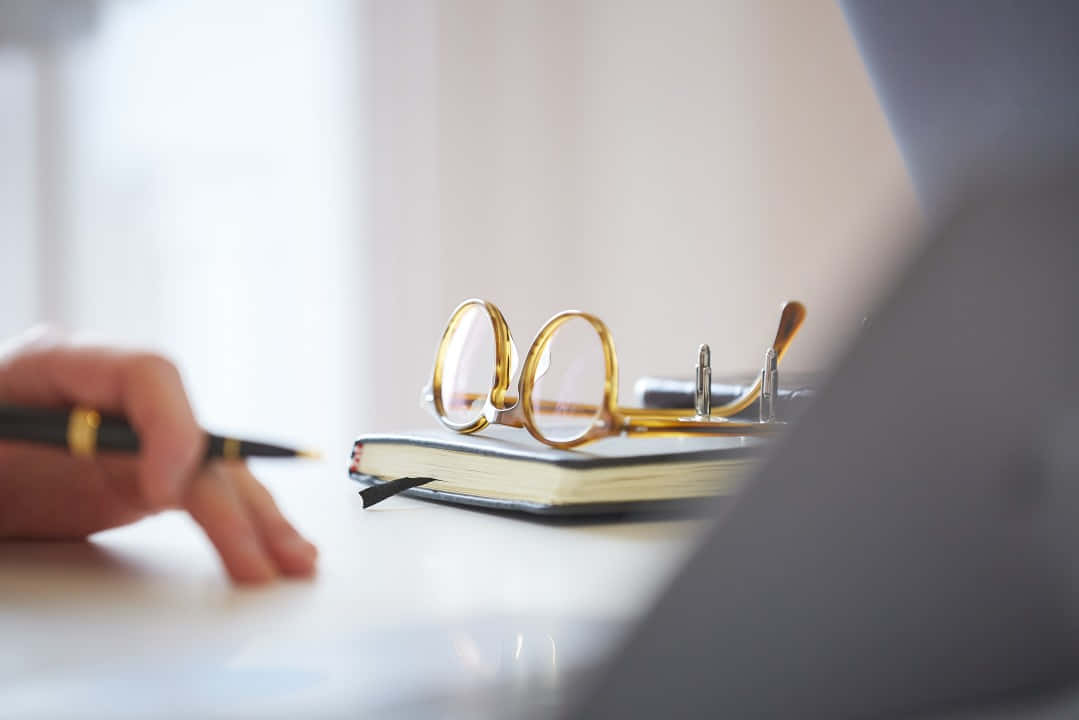 Contract Documents And Golden Eyeglasses Wallpaper