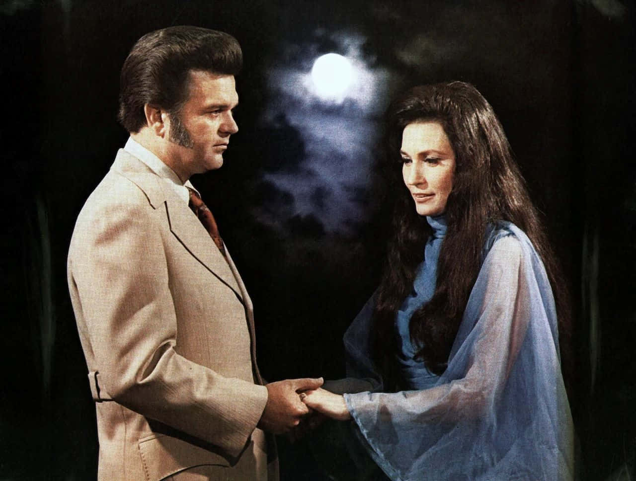 Conway Twittyand Female Companion Moonlit Encounter Wallpaper