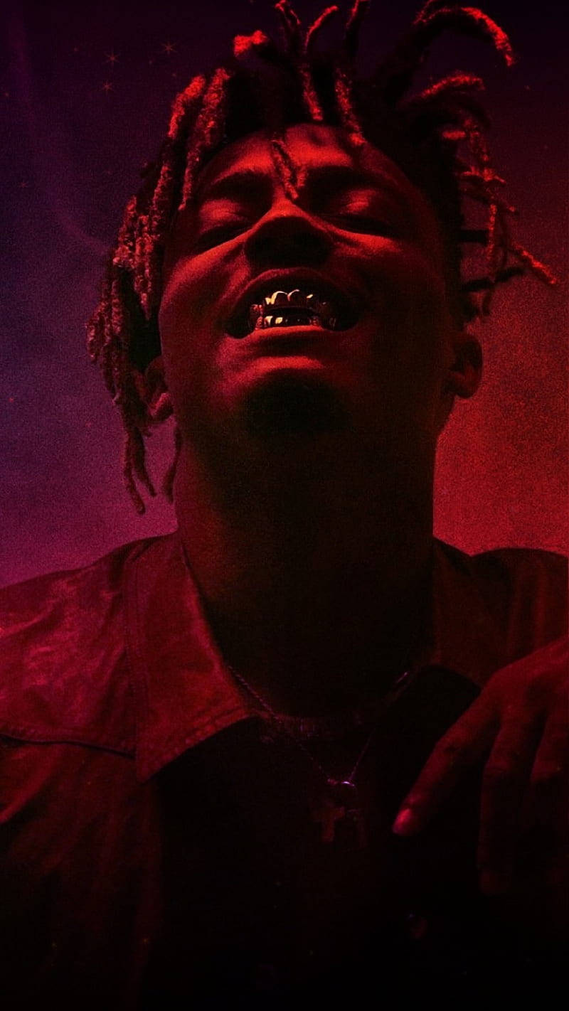 Cool Juice Wrld Showing His Teeth Wallpaper