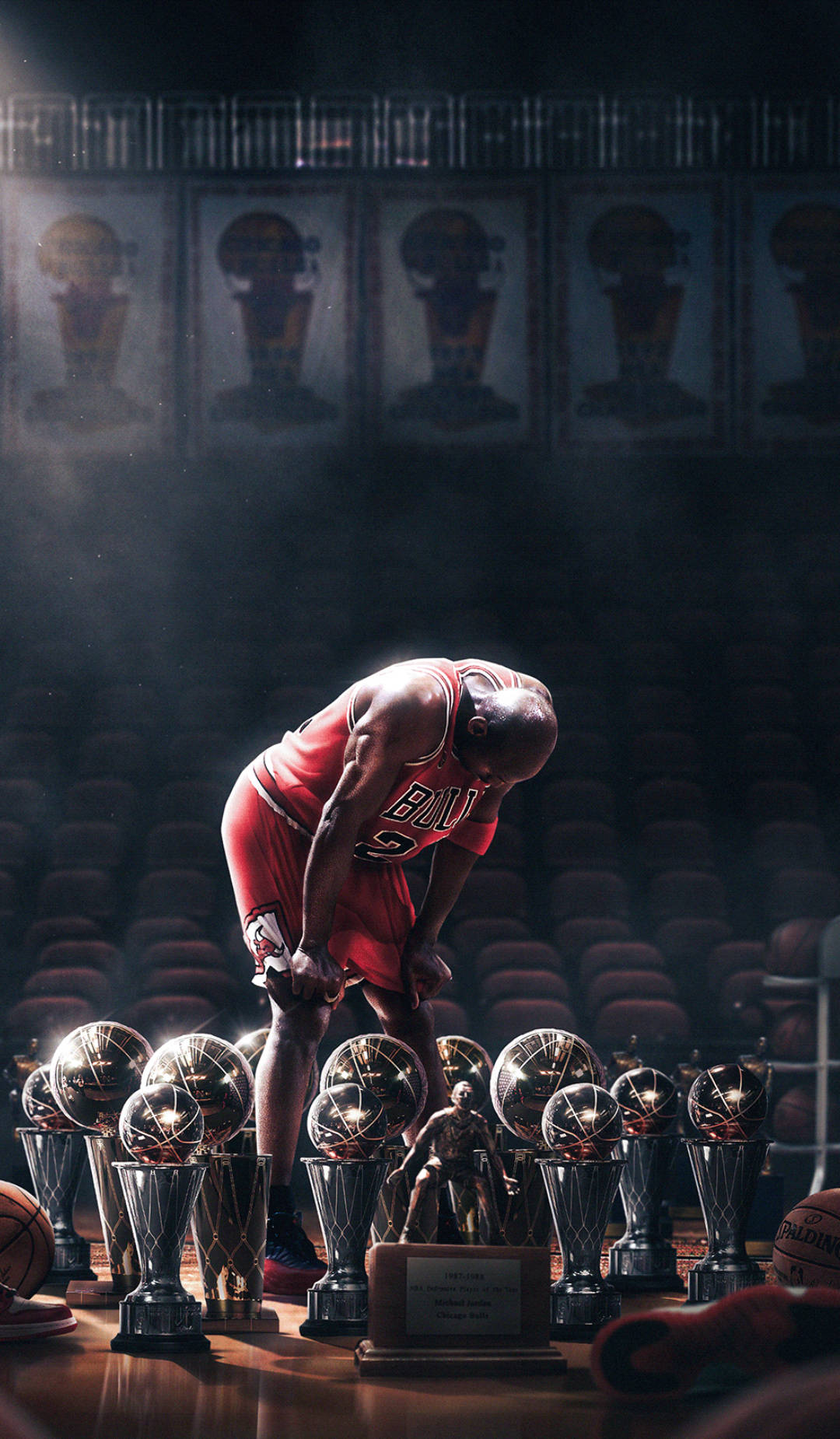 Cool Michael Jordan Trophies In Spotlight Wallpaper