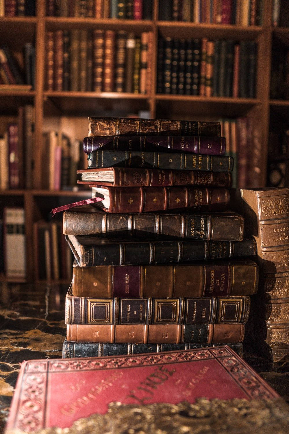 Cool Vintage Books On Table Portrait Wallpaper