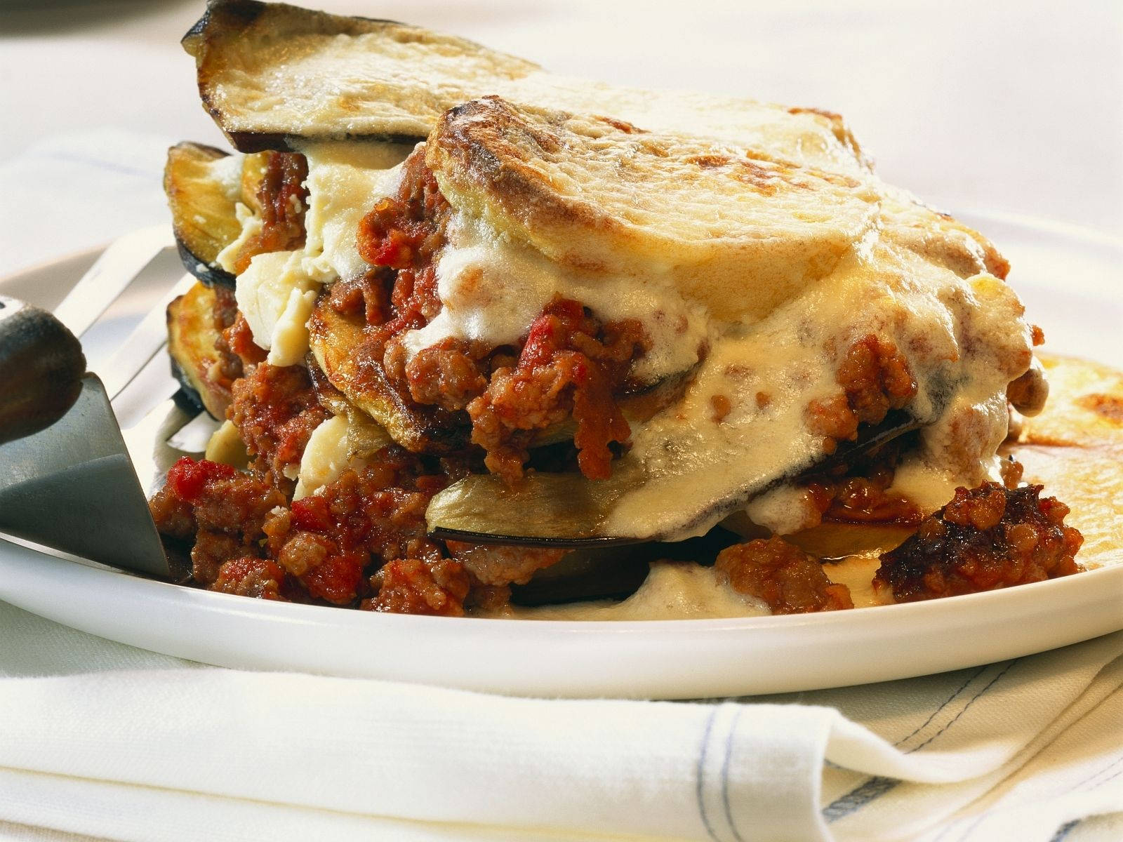 Creamy Layered Moussaka On A Plate Wallpaper