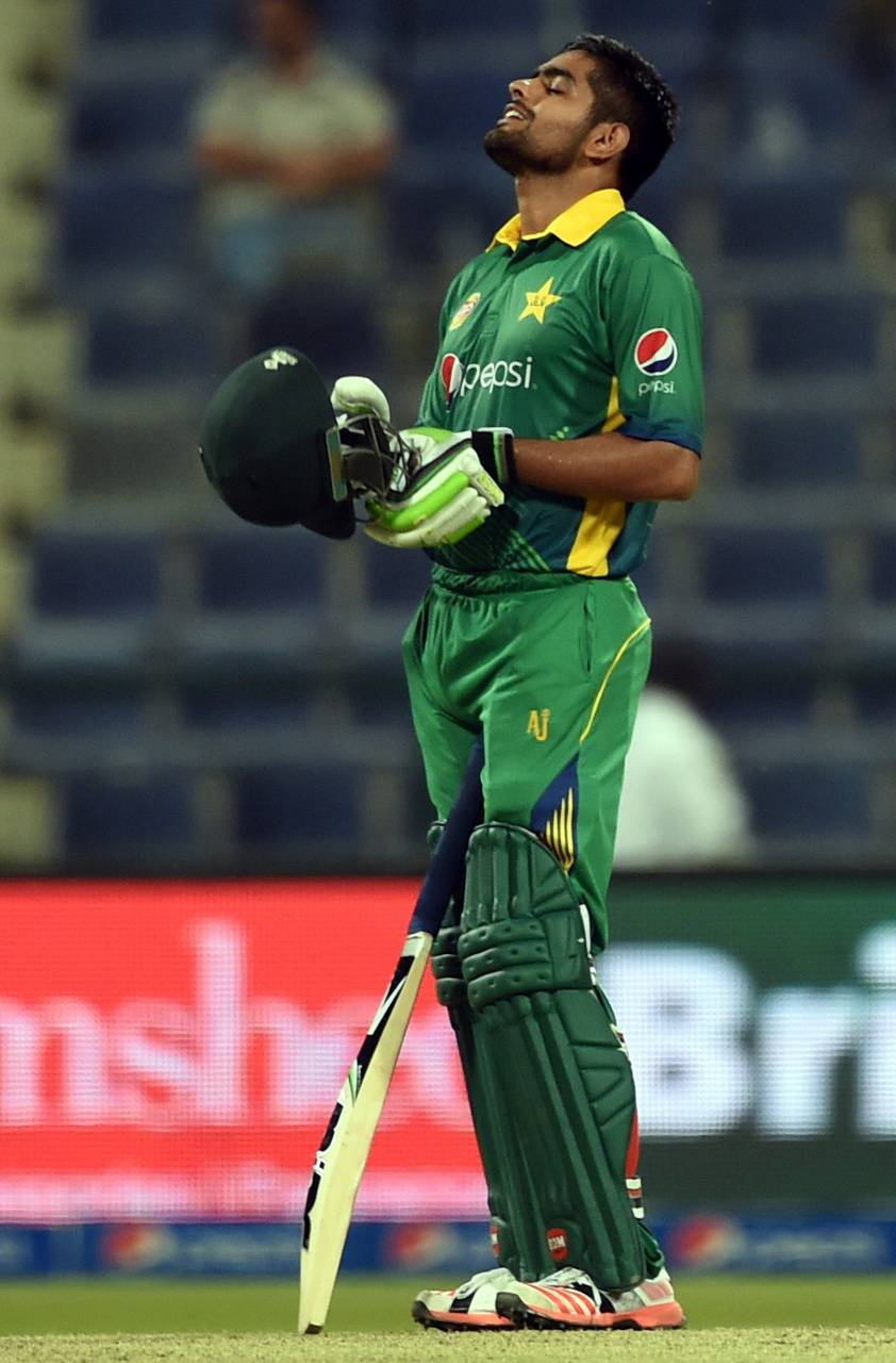 Cricketer Babar Azam In Vibrant Green Pakistan Cricket Uniform Wallpaper