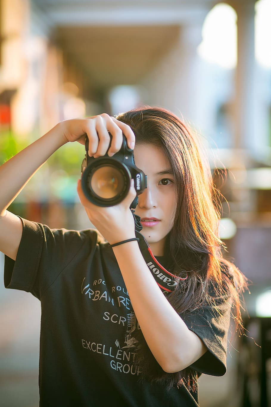 Cute Woman Holding Camera Wallpaper