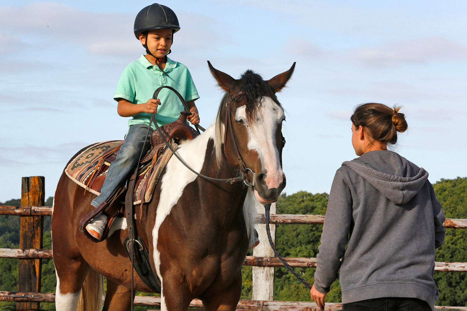 Cute Young Equestrian Horseback Riding Wallpaper