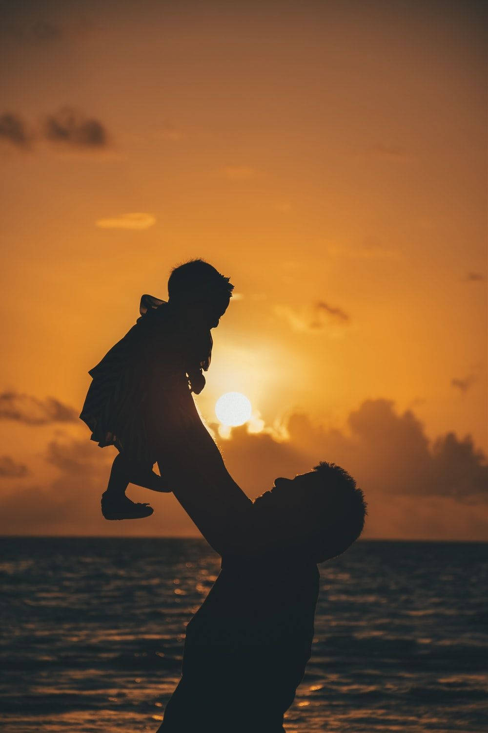 Dad Admiring Baby Wallpaper