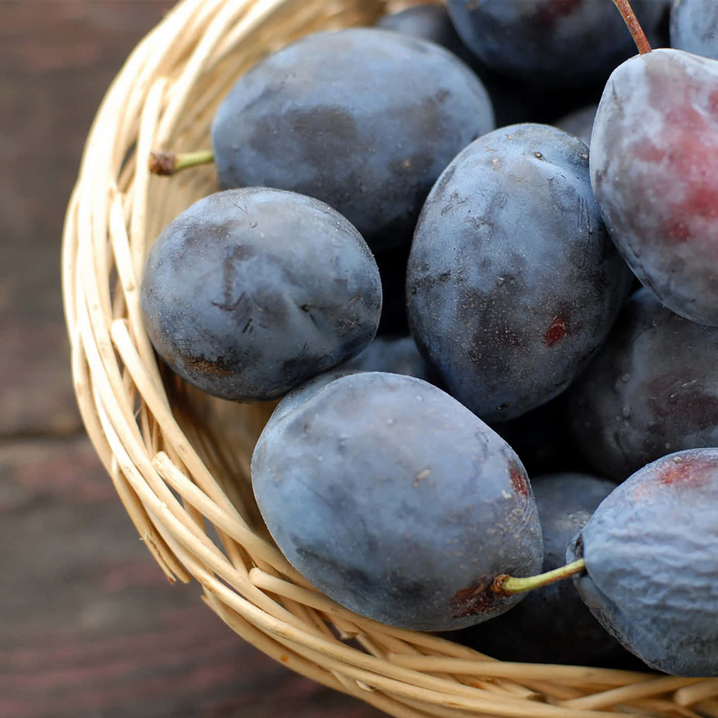 Damson Plums On A Wicket Basket Wallpaper