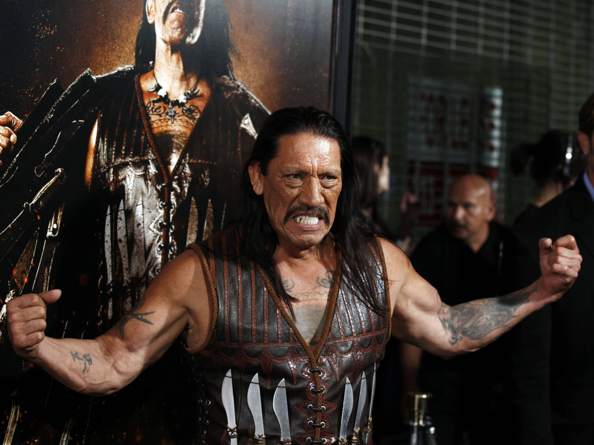 Danny Trejo Powerfully Flexing Muscles In Machete Film Event Wallpaper