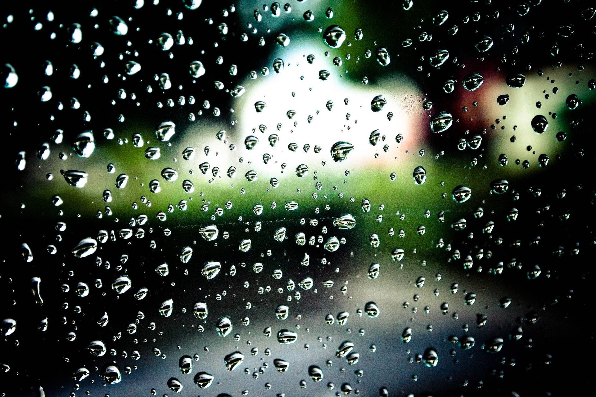 Dark Tiny Raindrops On Green Bokeh Wallpaper