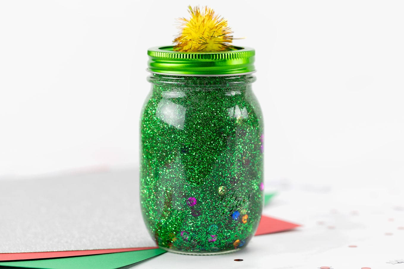 Dazzling Green Glitter In A Glass Jar Wallpaper