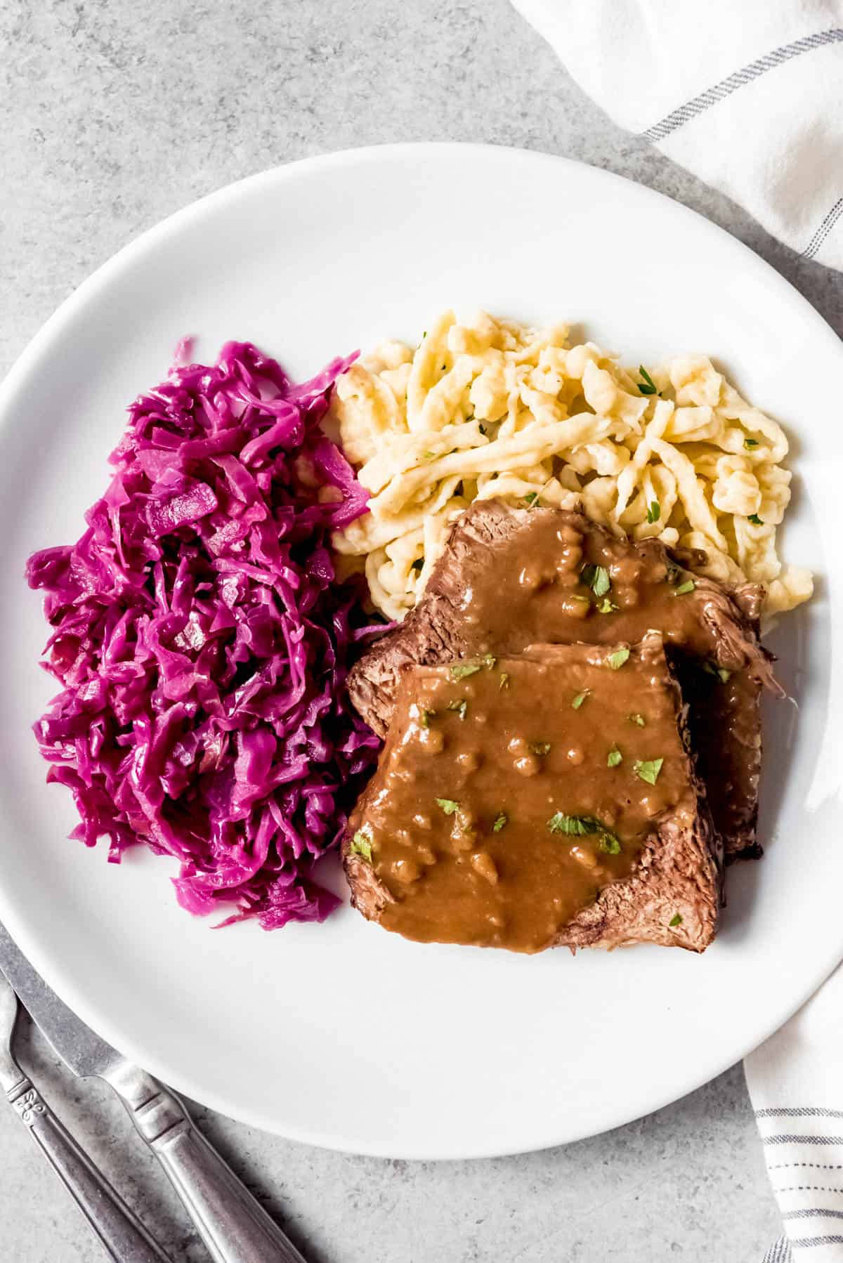 Delectable Sauerbraten Dish With Red Cabbage And Spaetzle Wallpaper